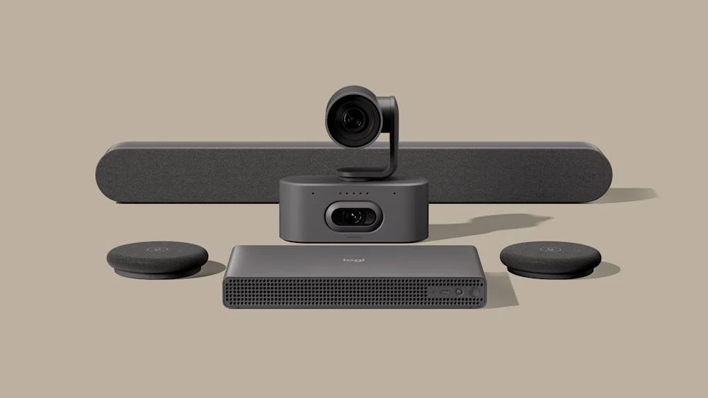Logitech Rally System 2 Pro components: Rally AI Camera Pro, Rally Speaker 2, two Rally Mic Pod 2 units and RoomMate 2 Pro