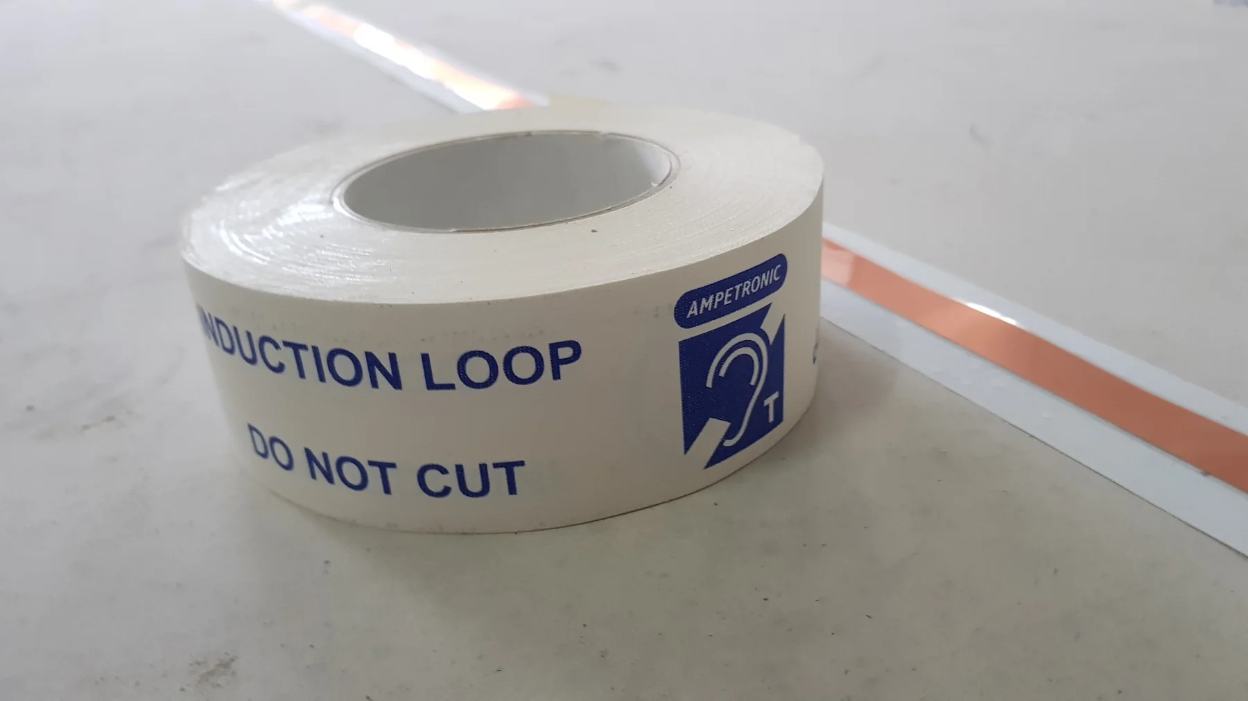 Ampetronic induction loop do not cut warning tape protecting installed hearing-loop conductors